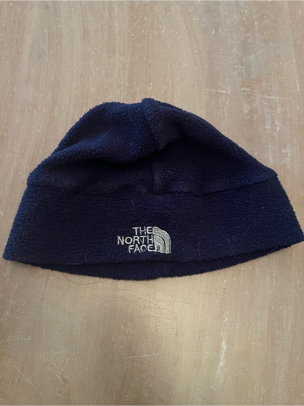 The North Face  Navy Fleece Hat with White Logo